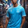 CAMISETA BLANCO Y CELESTE HOJAS