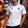 CAMISETA BLANCO Y CELESTE HOJAS